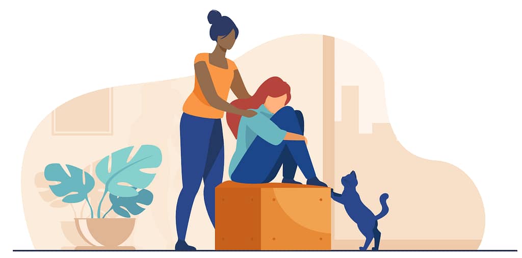 A cartoon of a sad looking woman, sat on a box, hugging her knees in despair. A cat is stood on its back paws, front paws leaning on the box, looking at her. A second woman stands behind her, offering comfort by gently holding her shoulders.