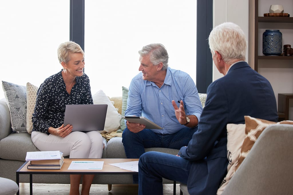 Three elderly people sat in a living room having a discussion. For loss of mental capacity blog.