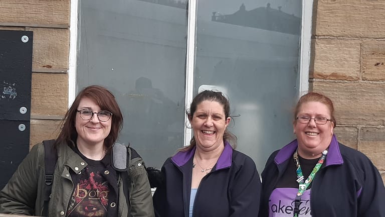 Mel, Stevie and Sarah smiling outside the TakeTen building